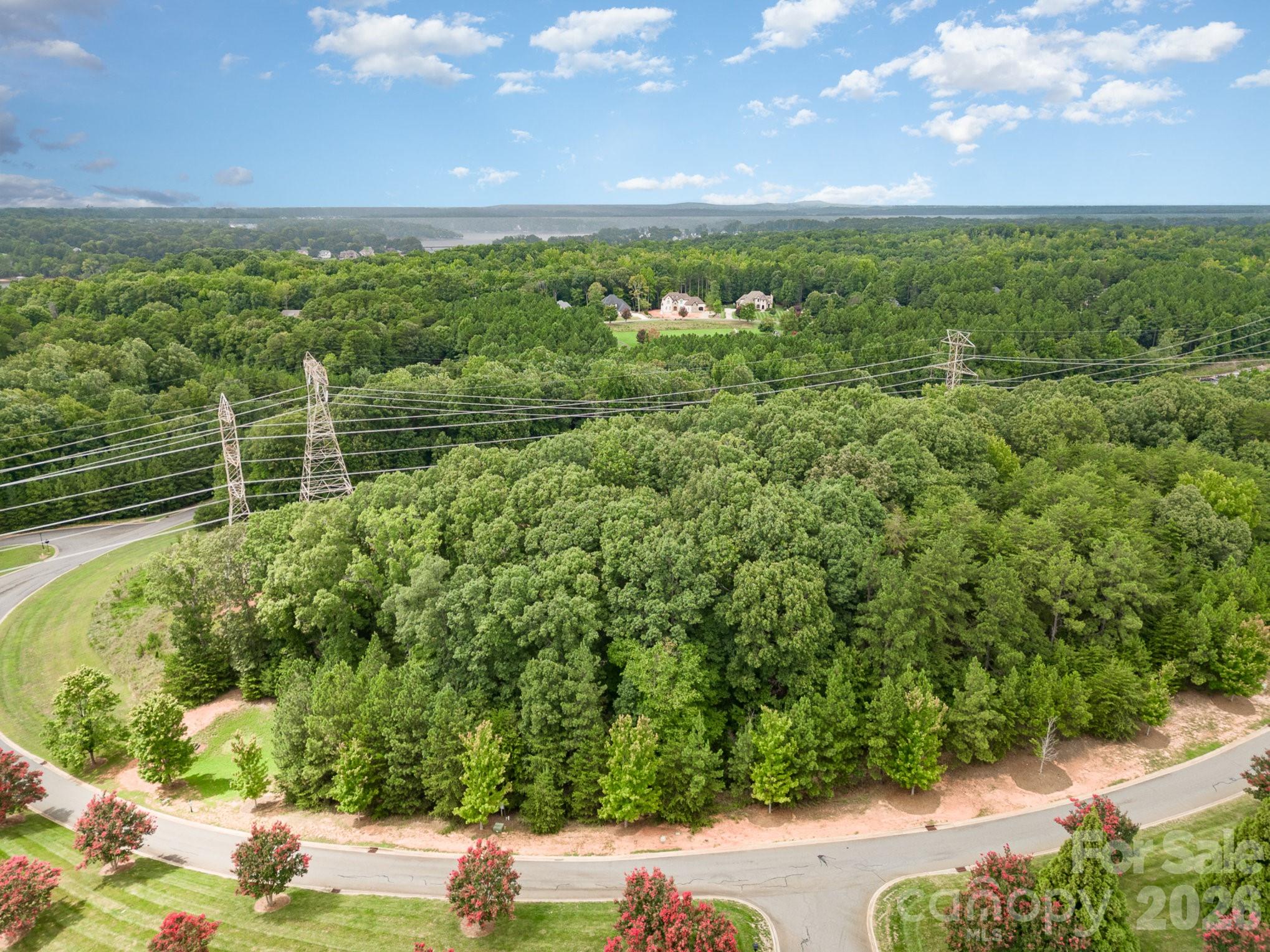 1400 Reflection Pointe Boulevard, Unit 327 Belmont, NC 28012 - Photo 17 of 19 a view of a lake with a city