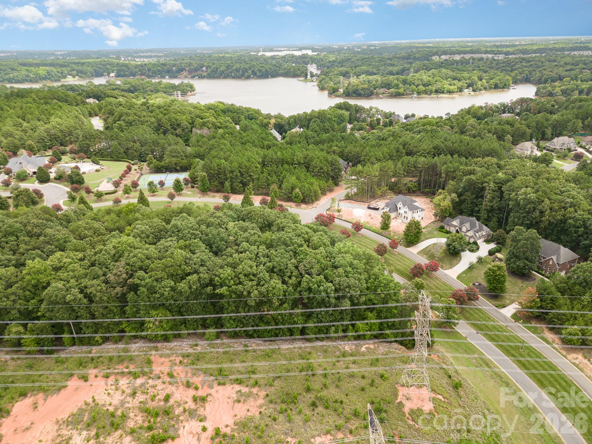 1400 Reflection Pointe Boulevard, Unit 327 Belmont, NC 28012 - Photo 18 of 19 a view of a lake from a balcony