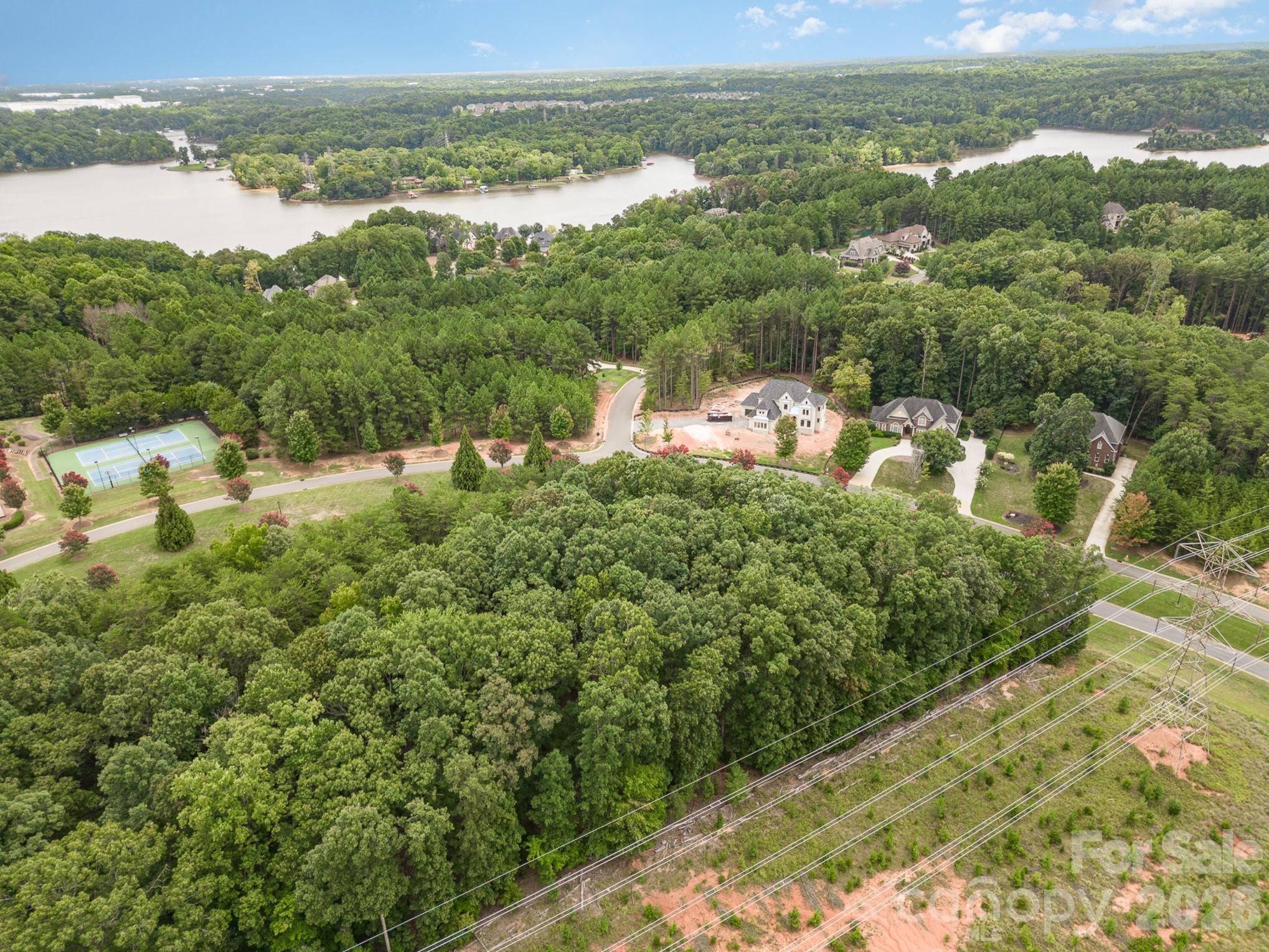 1400 Reflection Pointe Boulevard, Unit 327 Belmont, NC 28012 - Photo 19 of 19 a view of a lake with a city