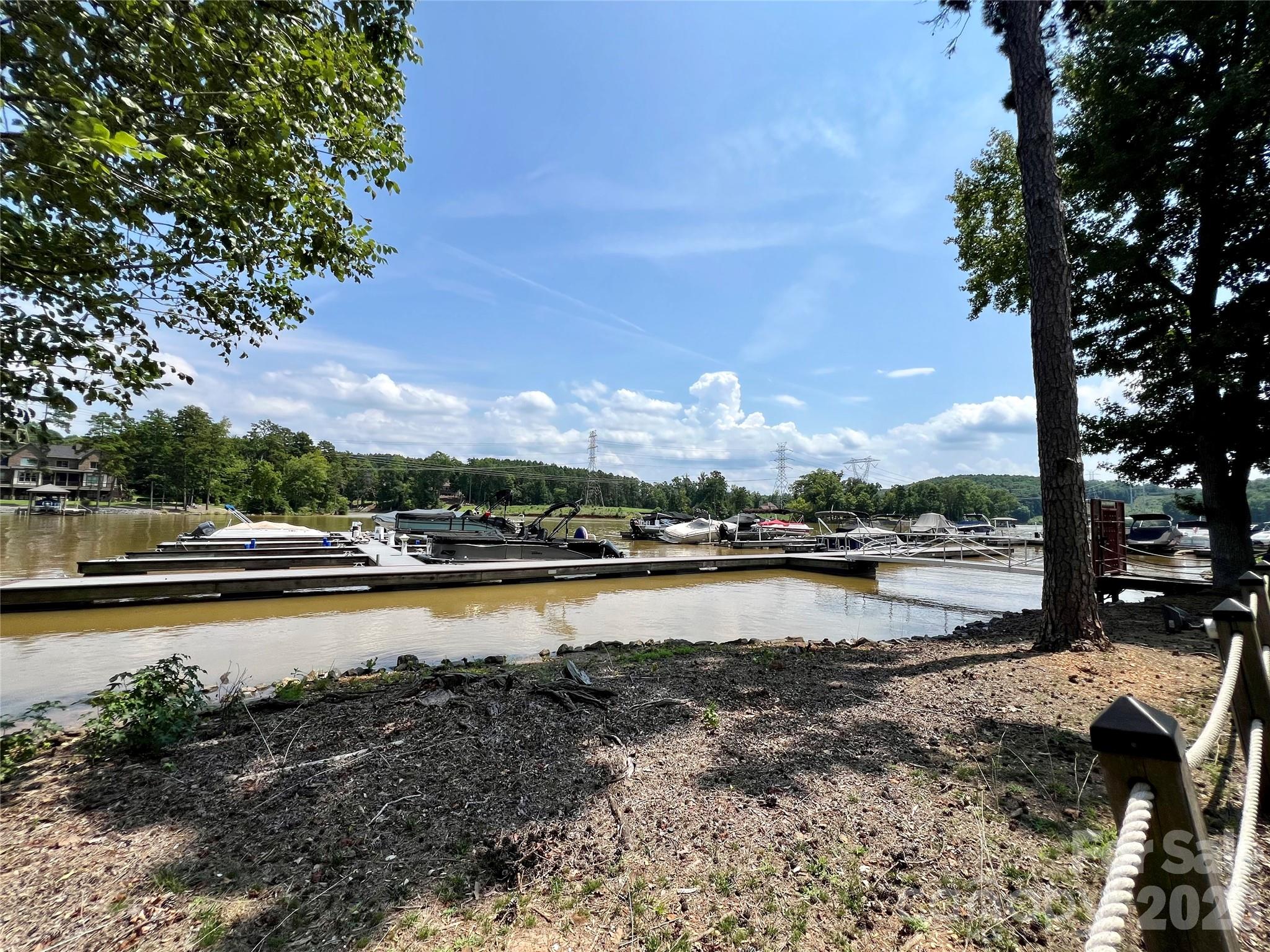 1400 Reflection Pointe Boulevard, Unit 327 Belmont, NC 28012 - Photo 9 of 19 a view of swimming pool and lake view