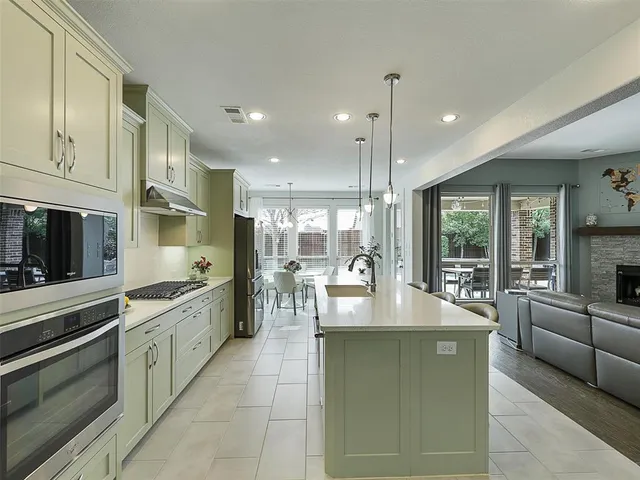 a large kitchen with granite countertop lots of counter top space