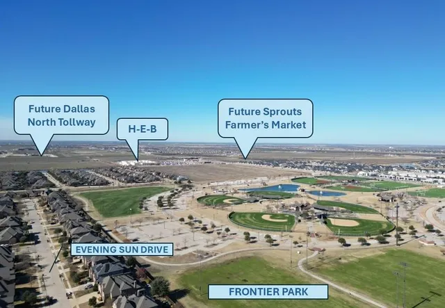 a view of a street with a bench and car parked