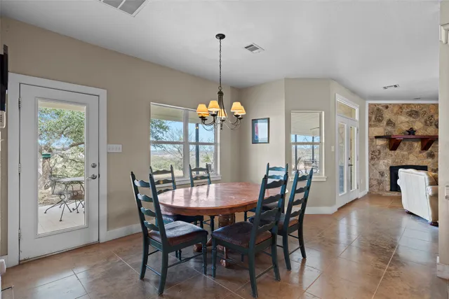 a bedroom with a bed mirror and a window