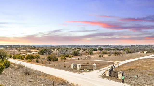 a view of outdoor space with seating area and trees around
