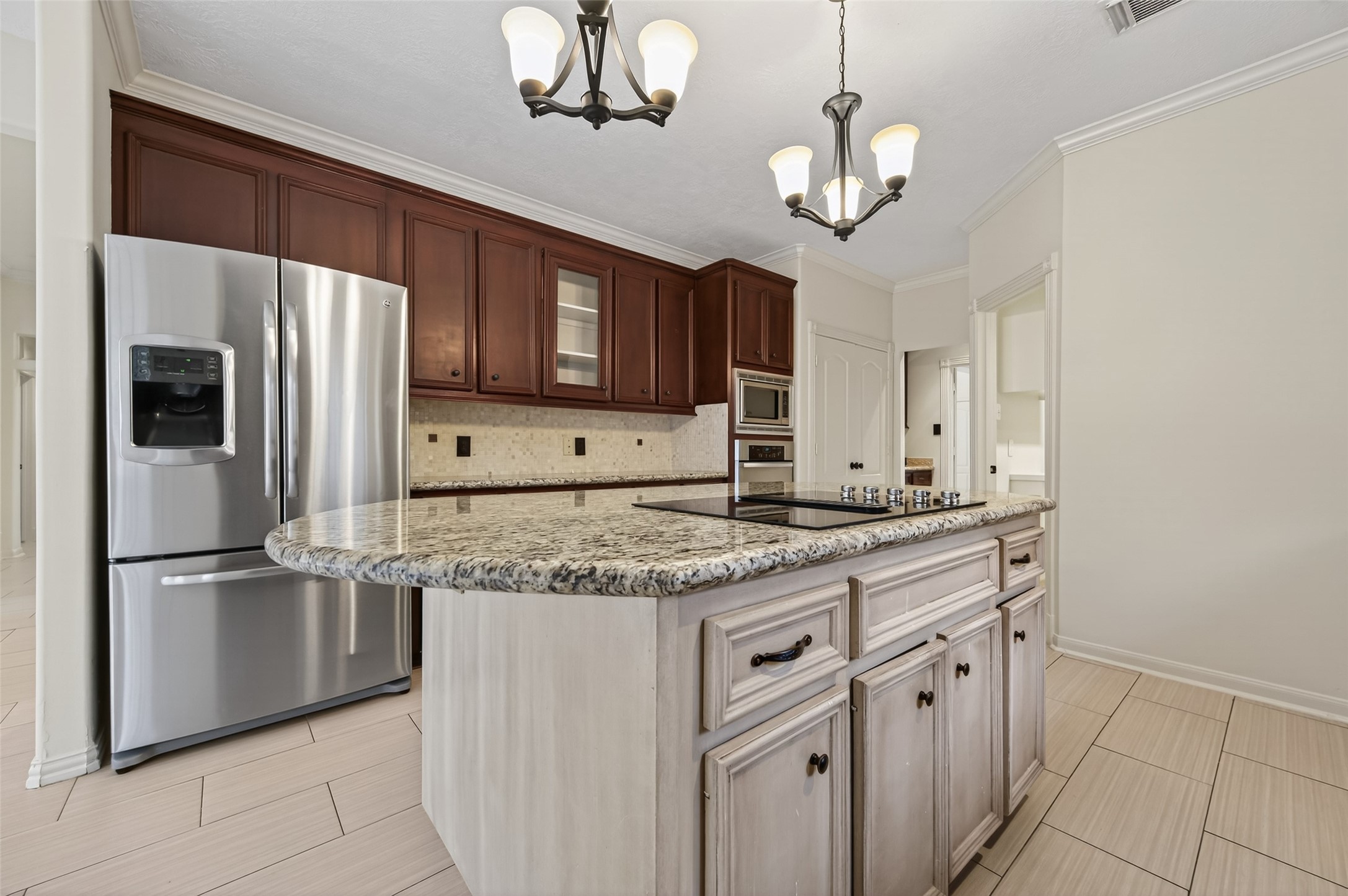 2115 Foreland Drive Houston, TX 77077 - Photo 15 of 50 Island kitchen with cooktop