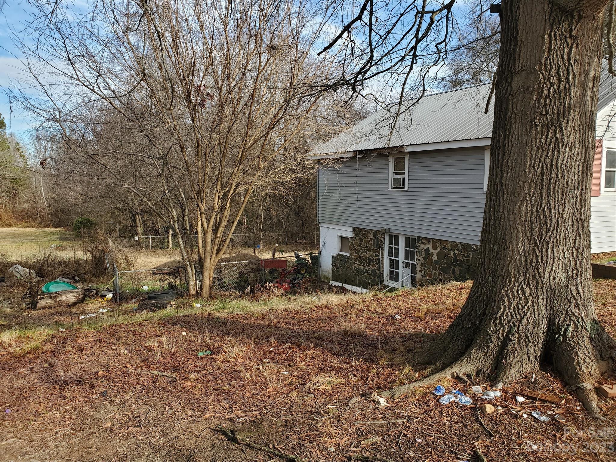 4260 Potneck Road Woodleaf, NC 27054 - Photo 11 of 11 a view of a house with a yard covered in snow