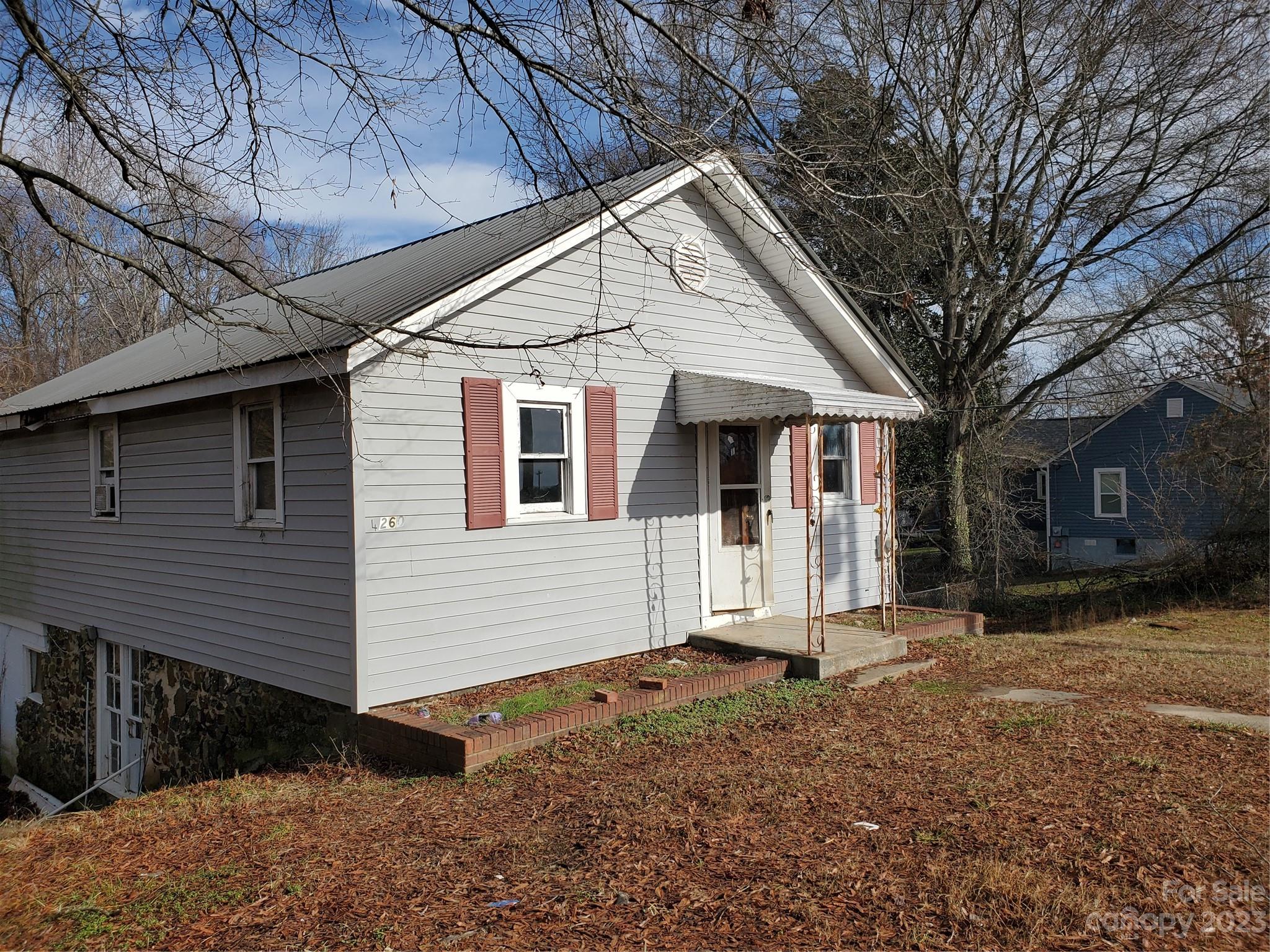 4260 Potneck Road Woodleaf, NC 27054 - Photo 2 of 11 a view of a white house with a large tree front of house
