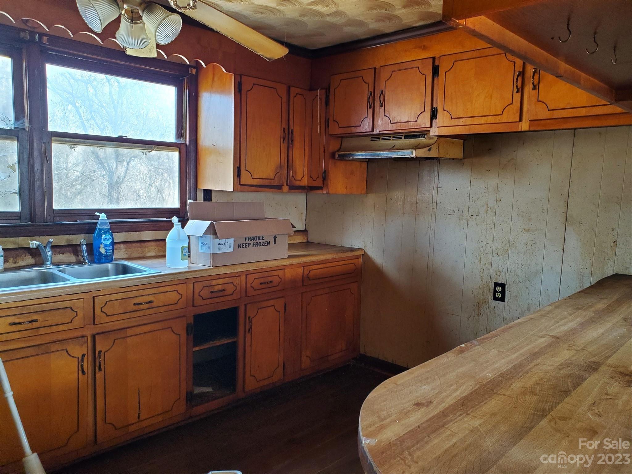4260 Potneck Road Woodleaf, NC 27054 - Photo 4 of 11 a kitchen with a sink cabinets and a large window