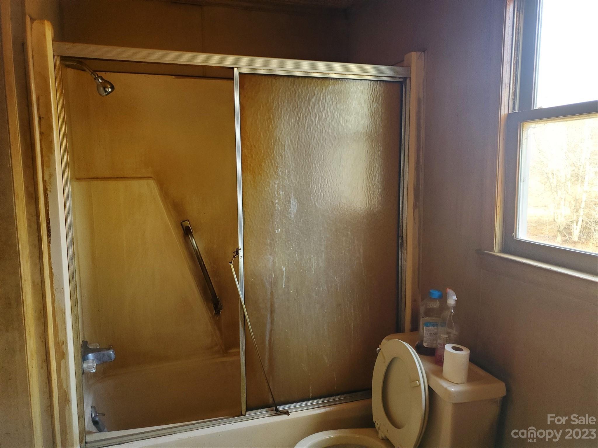 4260 Potneck Road Woodleaf, NC 27054 - Photo 5 of 11 a bathroom with a shower and toilet