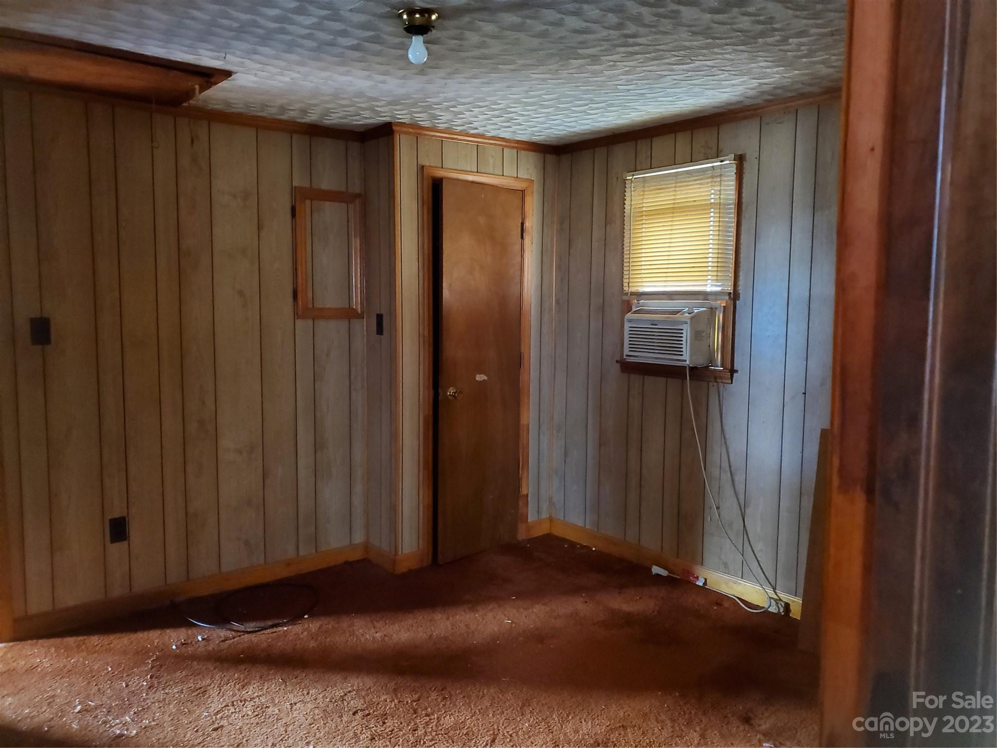 4260 Potneck Road Woodleaf, NC 27054 - Photo 6 of 11 a view of a hallway with wooden walls