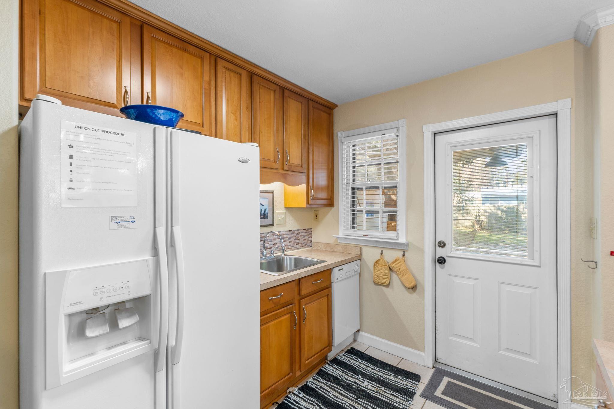 112 Cousineau Road Pensacola, FL 32507 - Photo 15 of 54 a white refrigerator freezer and a dishwasher in a kitchen