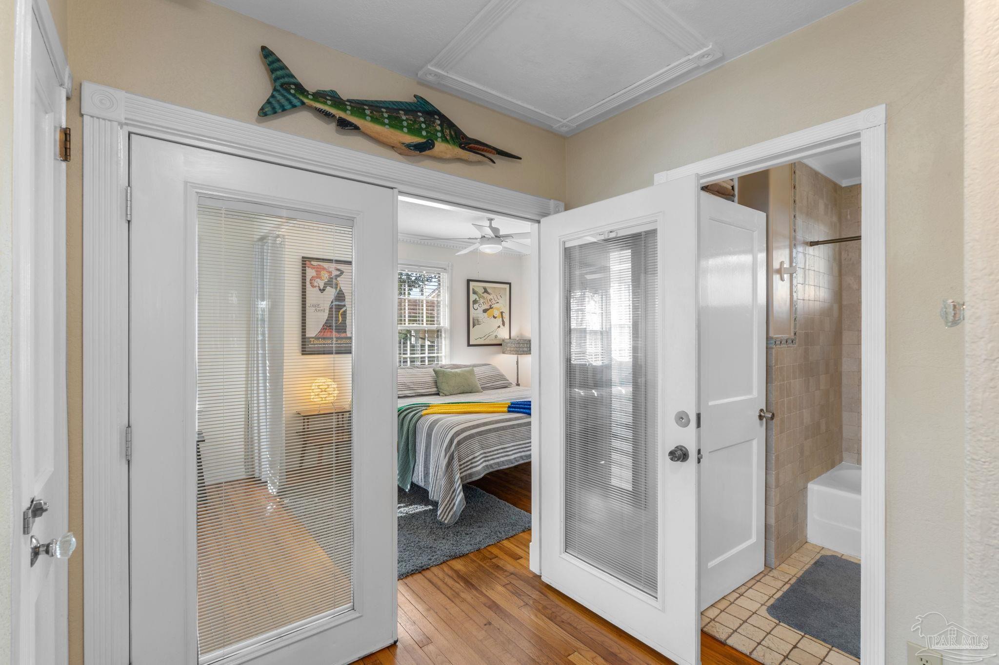 112 Cousineau Road Pensacola, FL 32507 - Photo 17 of 54 a view of a hallway with bathroom and wooden floor