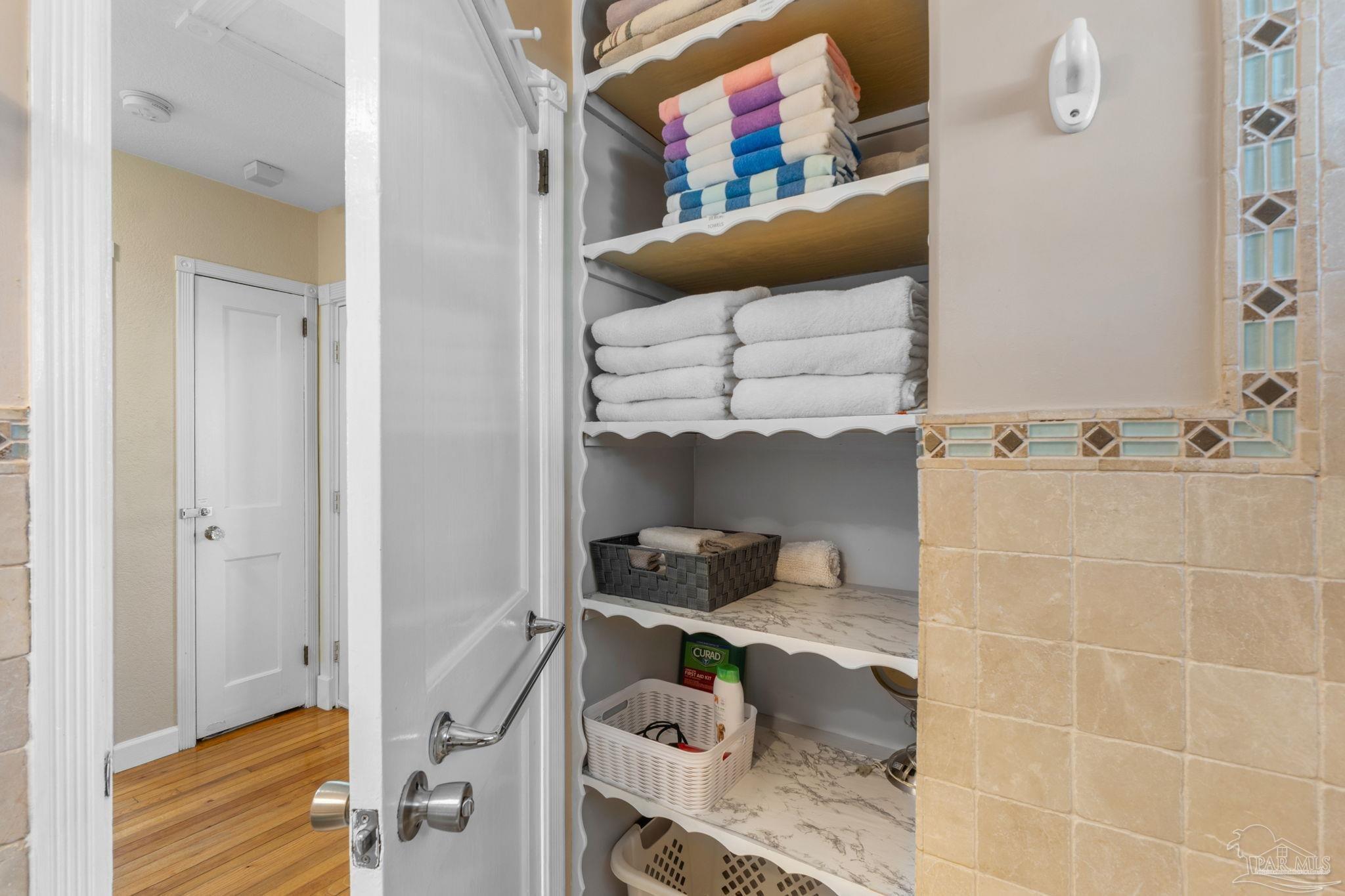 112 Cousineau Road Pensacola, FL 32507 - Photo 19 of 54 a room with a cabinets and a wooden floor