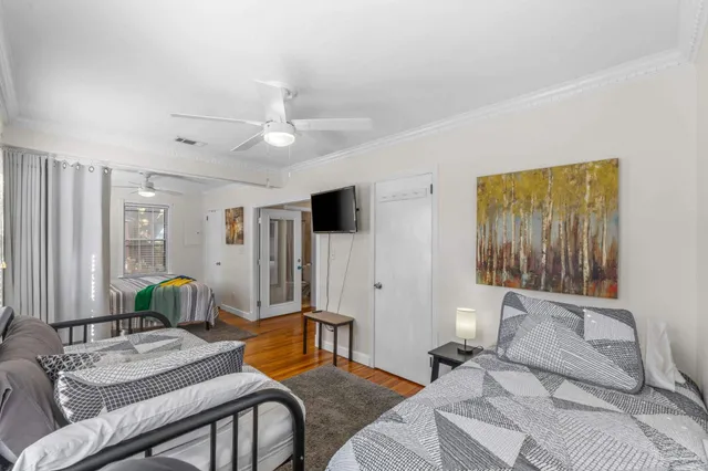 a bedroom with a bed and a window