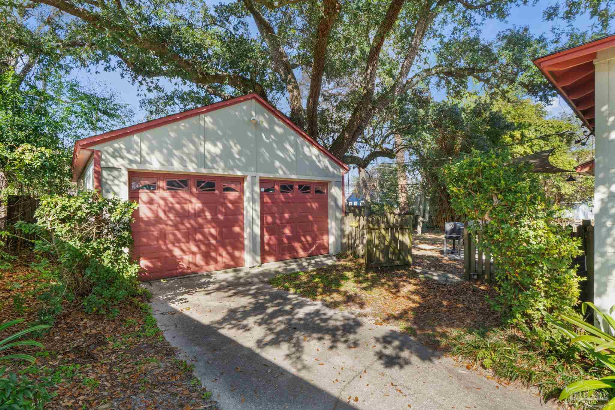 112 Cousineau Road Pensacola, FL 32507 - Photo 26 of 54 a view of a wooden house with a yard