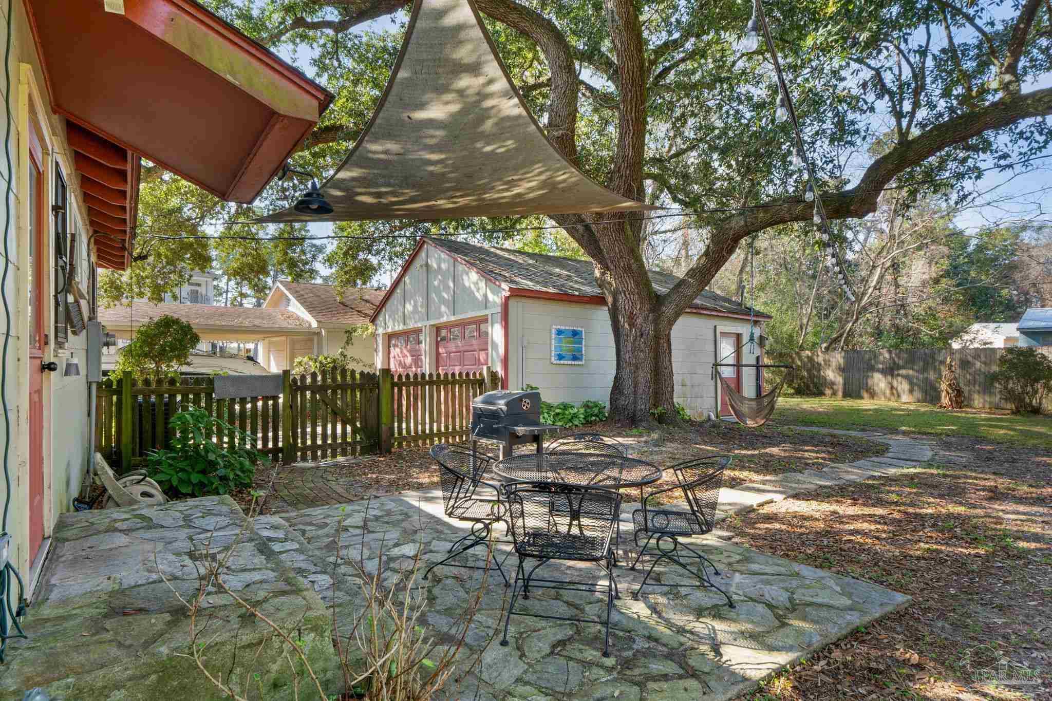112 Cousineau Road Pensacola, FL 32507 - Photo 29 of 54 a view of a house with backyard and a tree