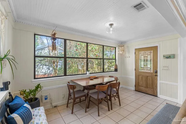a view of a dining room with furniture window and outside view
