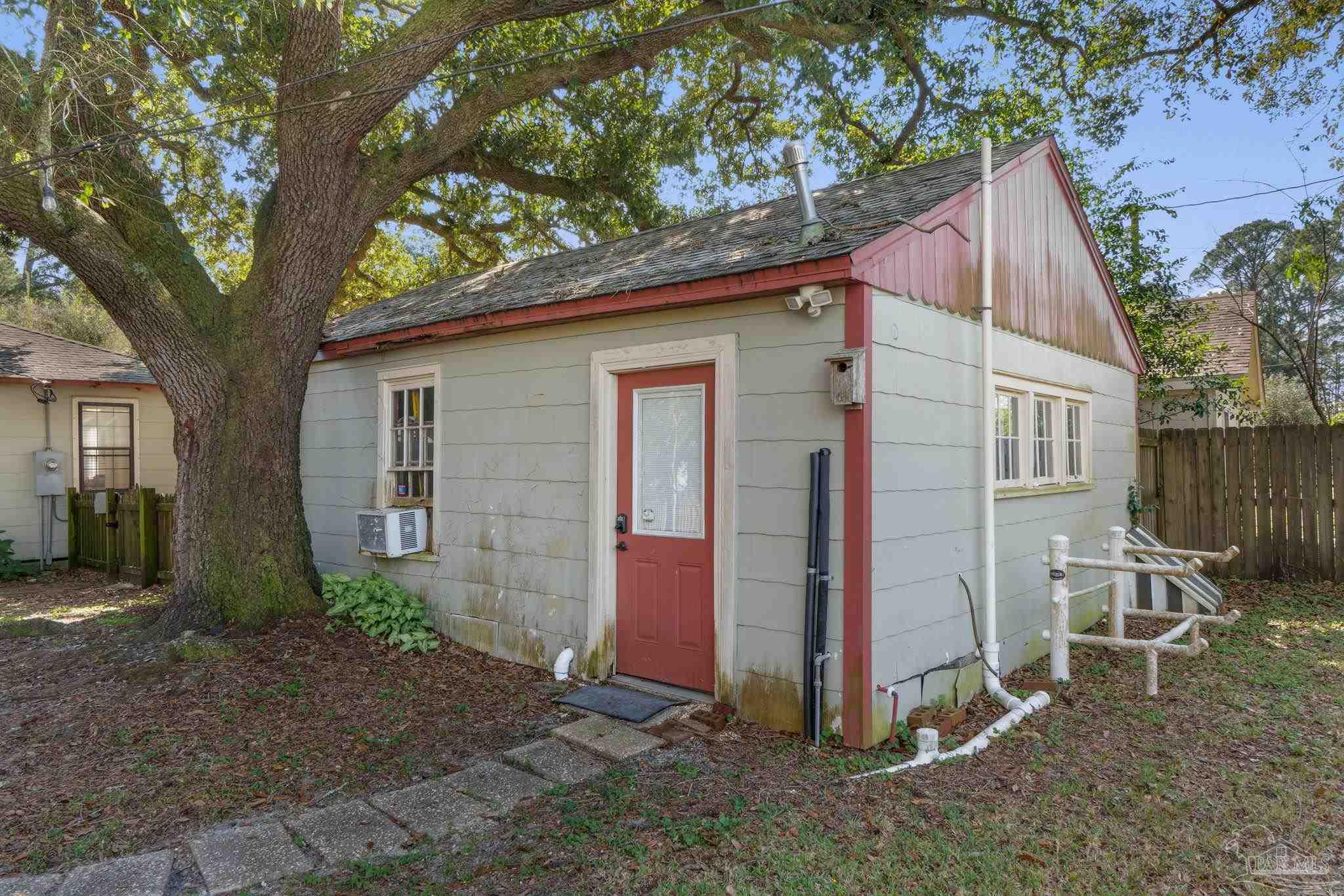 112 Cousineau Road Pensacola, FL 32507 - Photo 33 of 54 a view of a house with backyard and a tree