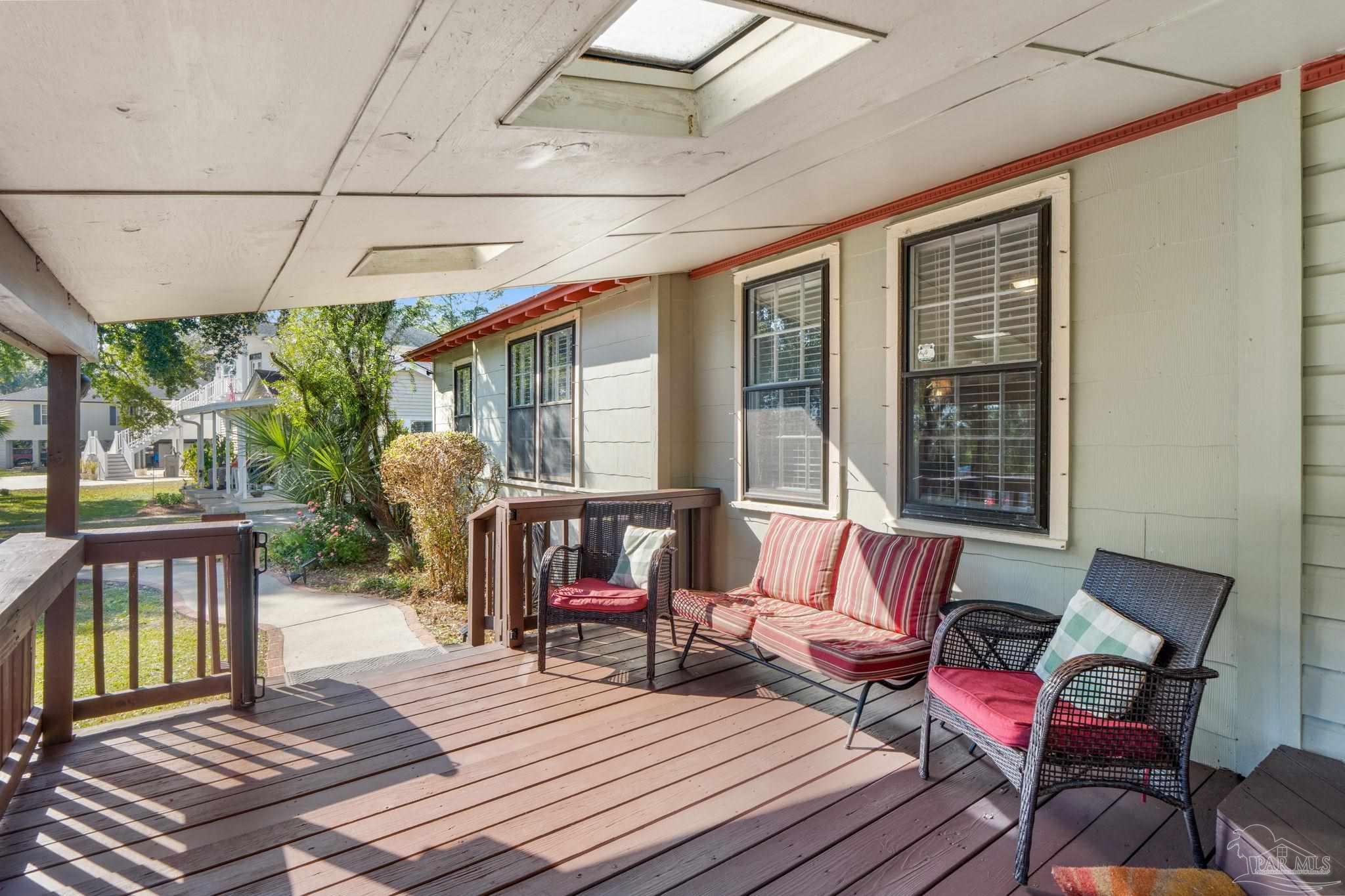 112 Cousineau Road Pensacola, FL 32507 - Photo 35 of 54 a balcony with wooden floor outdoor seating and wooden floors