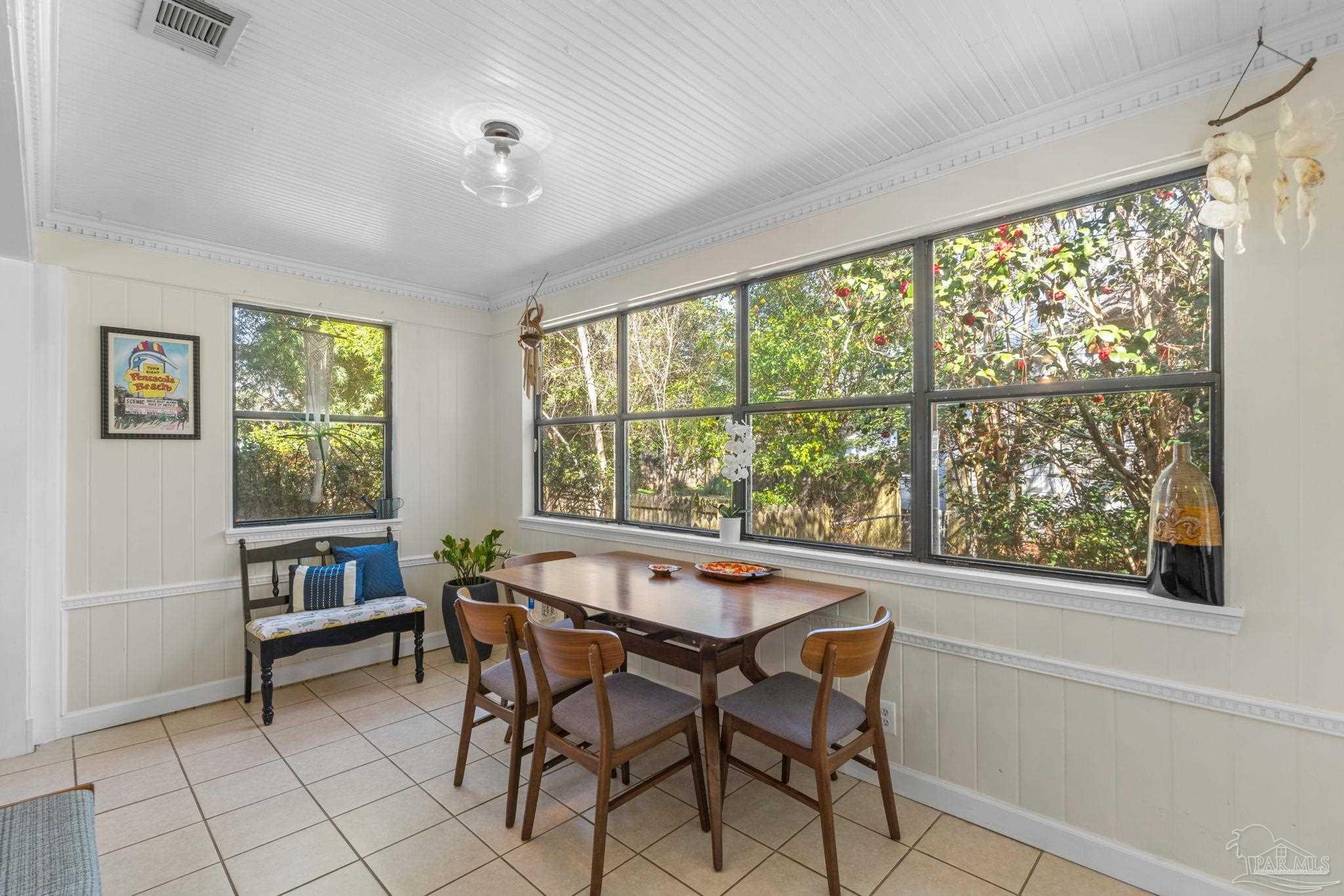 112 Cousineau Road Pensacola, FL 32507 - Photo 4 of 54 a dining room with furniture and a large window