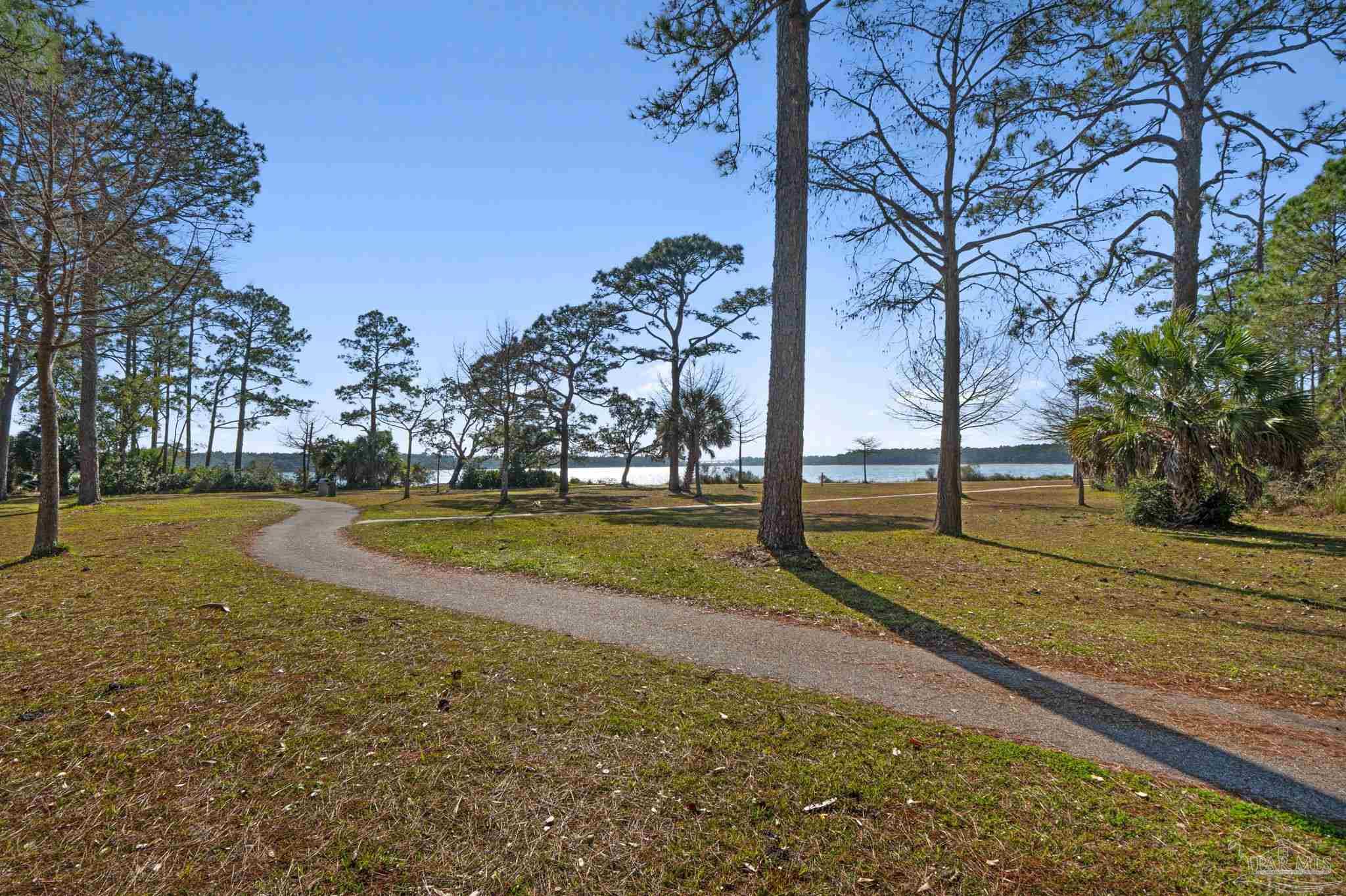 112 Cousineau Road Pensacola, FL 32507 - Photo 44 of 54 a view of a yard with palm trees
