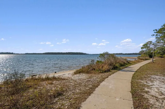a view of a lake with a yard