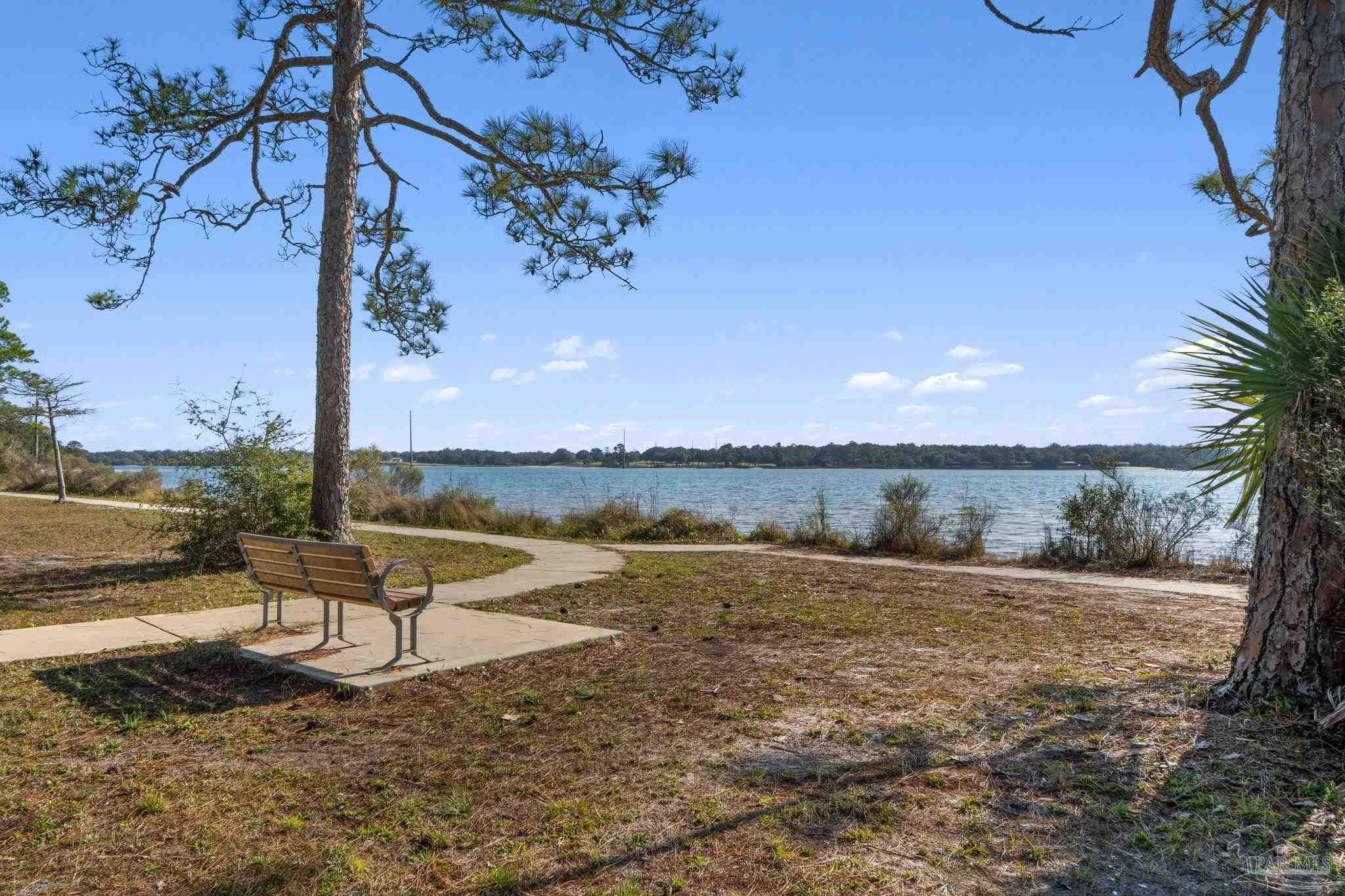 112 Cousineau Road Pensacola, FL 32507 - Photo 51 of 54 a view of a lake with a yard