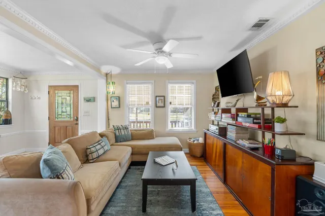 a living room with furniture and a flat screen tv