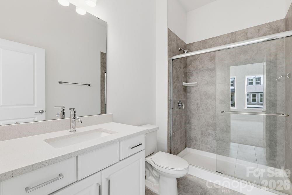 3159 Beacon Hts Road Indian Land, SC 29707 - Photo 14 of 33 a bathroom with a sink toilet and shower
