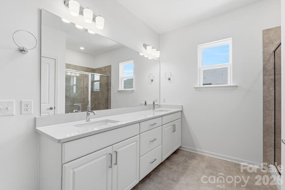 3159 Beacon Hts Road Indian Land, SC 29707 - Photo 6 of 33 a bathroom with a double vanity sink mirror and double