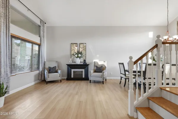 a kitchen with stainless steel appliances granite countertop a sink a stove and a wooden floors