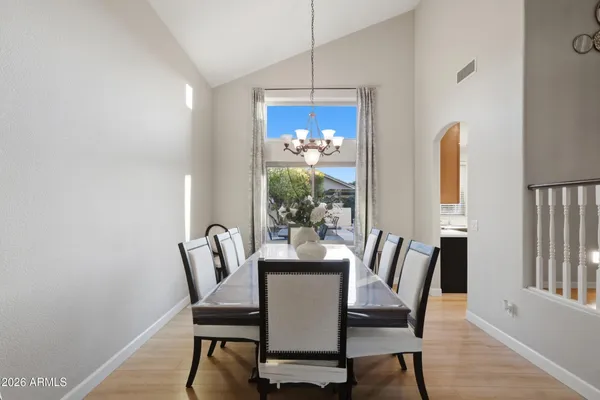 a dining room with furniture and window