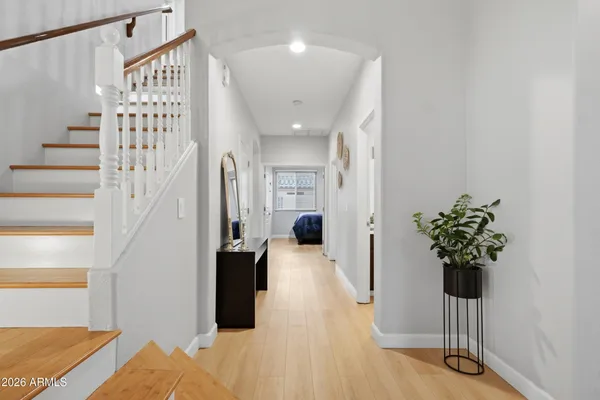 a bedroom with a bed tv and a window
