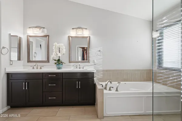 a bedroom with a bed and a desk