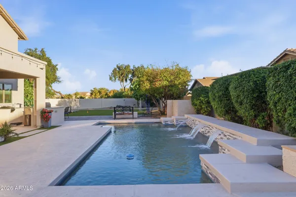 a view of a patio with swimming pool