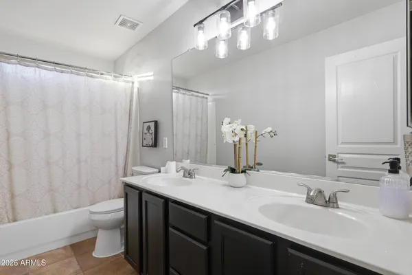 a front view of a house with sitting area