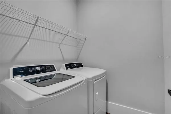 a utility room with dryer and washer