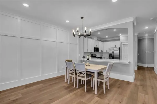 a view of a dining room with furniture and wooden floor