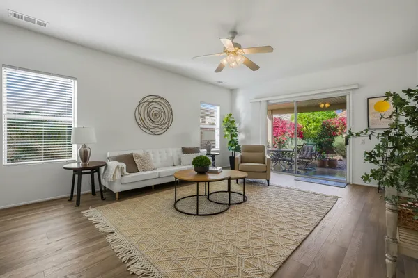 a living room with furniture and a large window