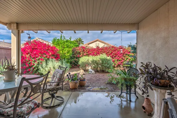a table and chairs in front of a house