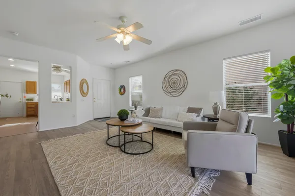 a living room with furniture and a large window