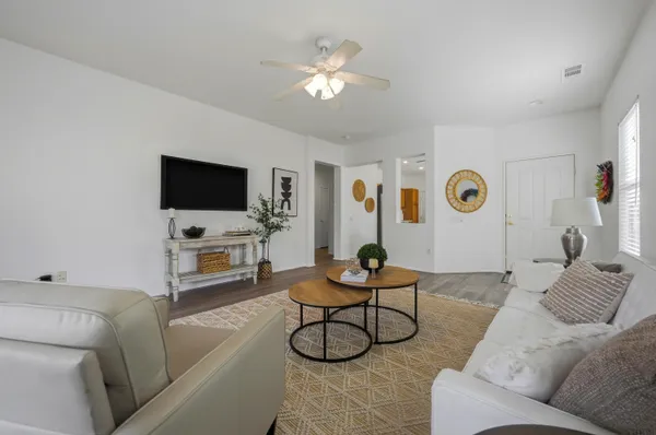 a living room with furniture and a flat screen tv