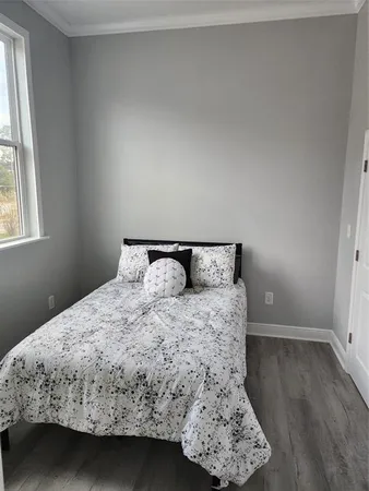 a en suite bathroom with a granite countertop sink and a mirror