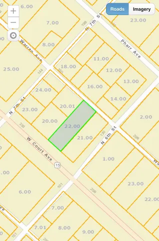 a white bench sitting in front of a building