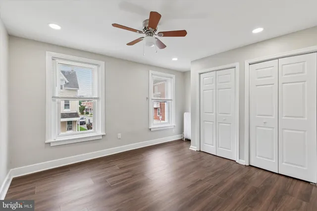 a view of livingroom with hardwood floor and a ceiling fan