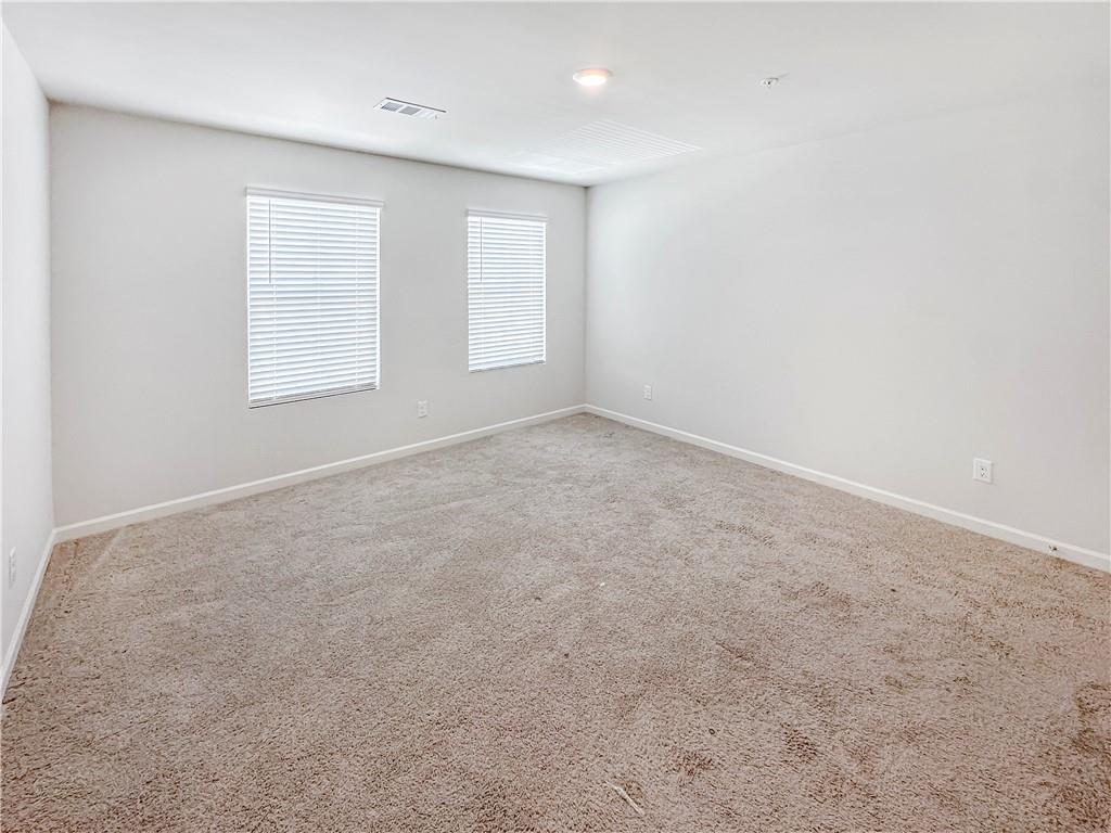 965 Athena Bend Fairburn, GA 30213 - Photo 19 of 37 an empty room with windows