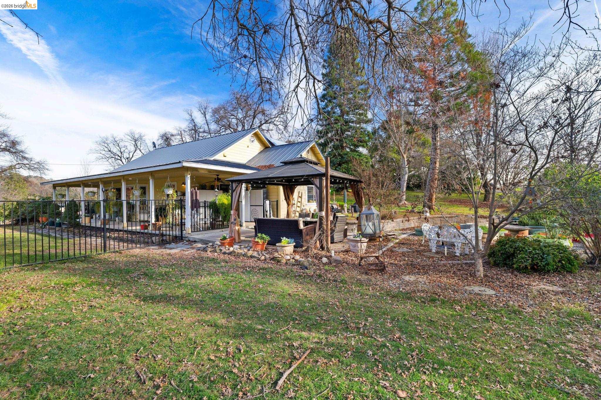 a view of a house with a yard porch and sitting area