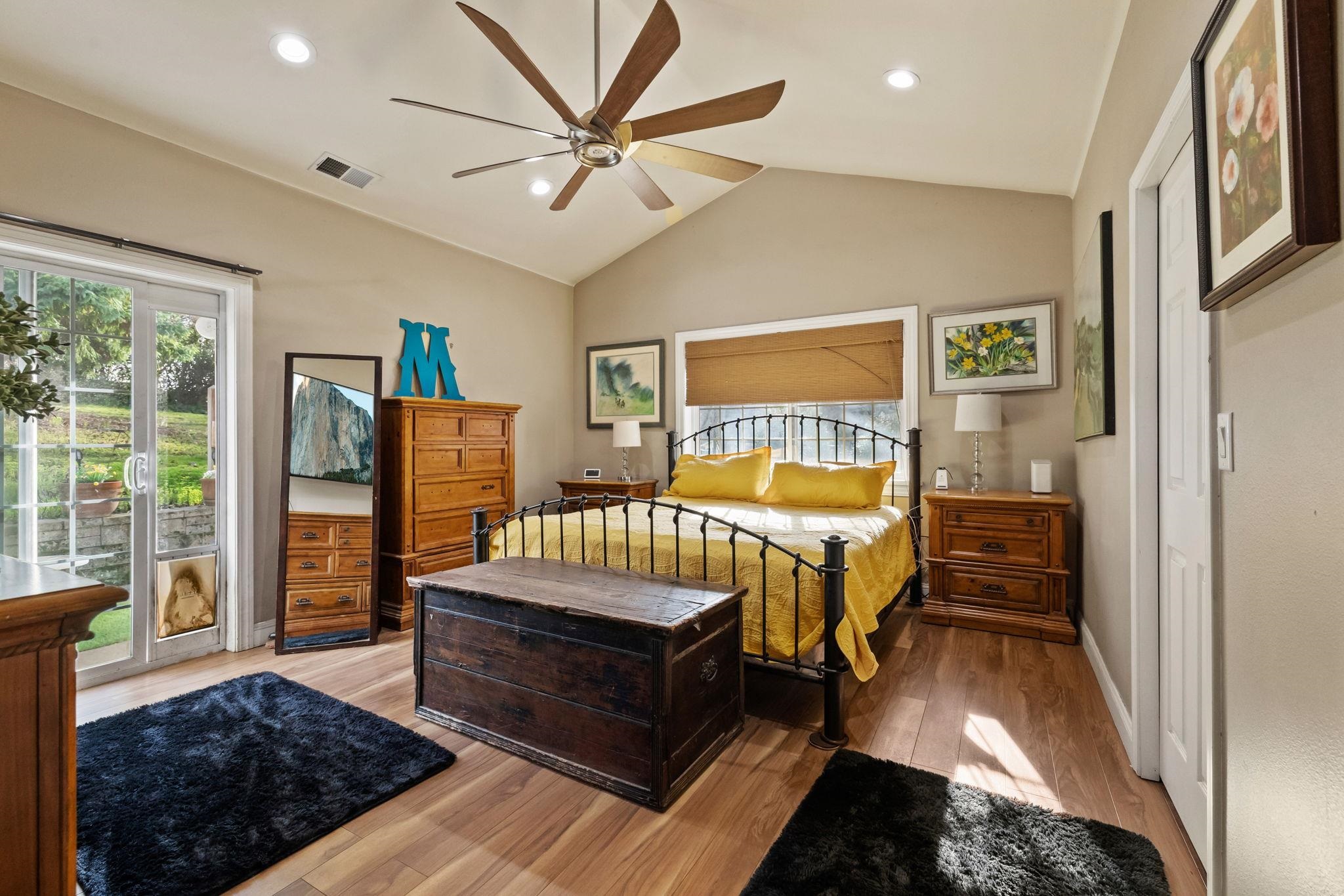 10177 Pulpit Rock Road Jamestown, CA 95327 - Photo 13 of 60 Bedroom with light wood-style floors, access to outside, a ceiling fan, multiple windows, and recessed lighting