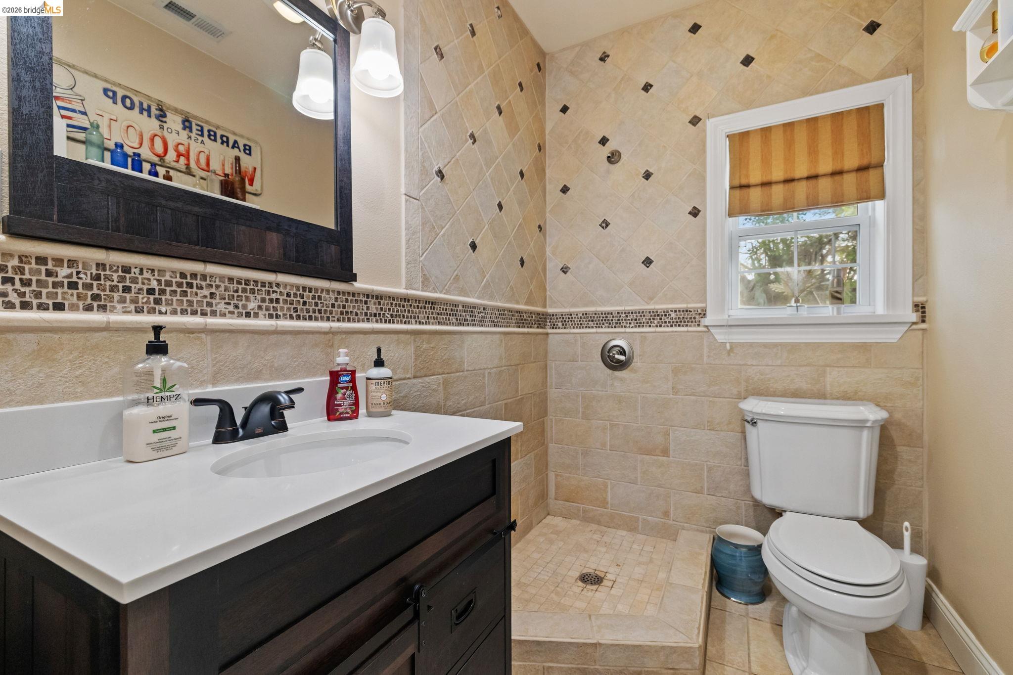 10177 Pulpit Rock Road Jamestown, CA 95327 - Photo 20 of 60 Full bathroom featuring vanity and tile walls