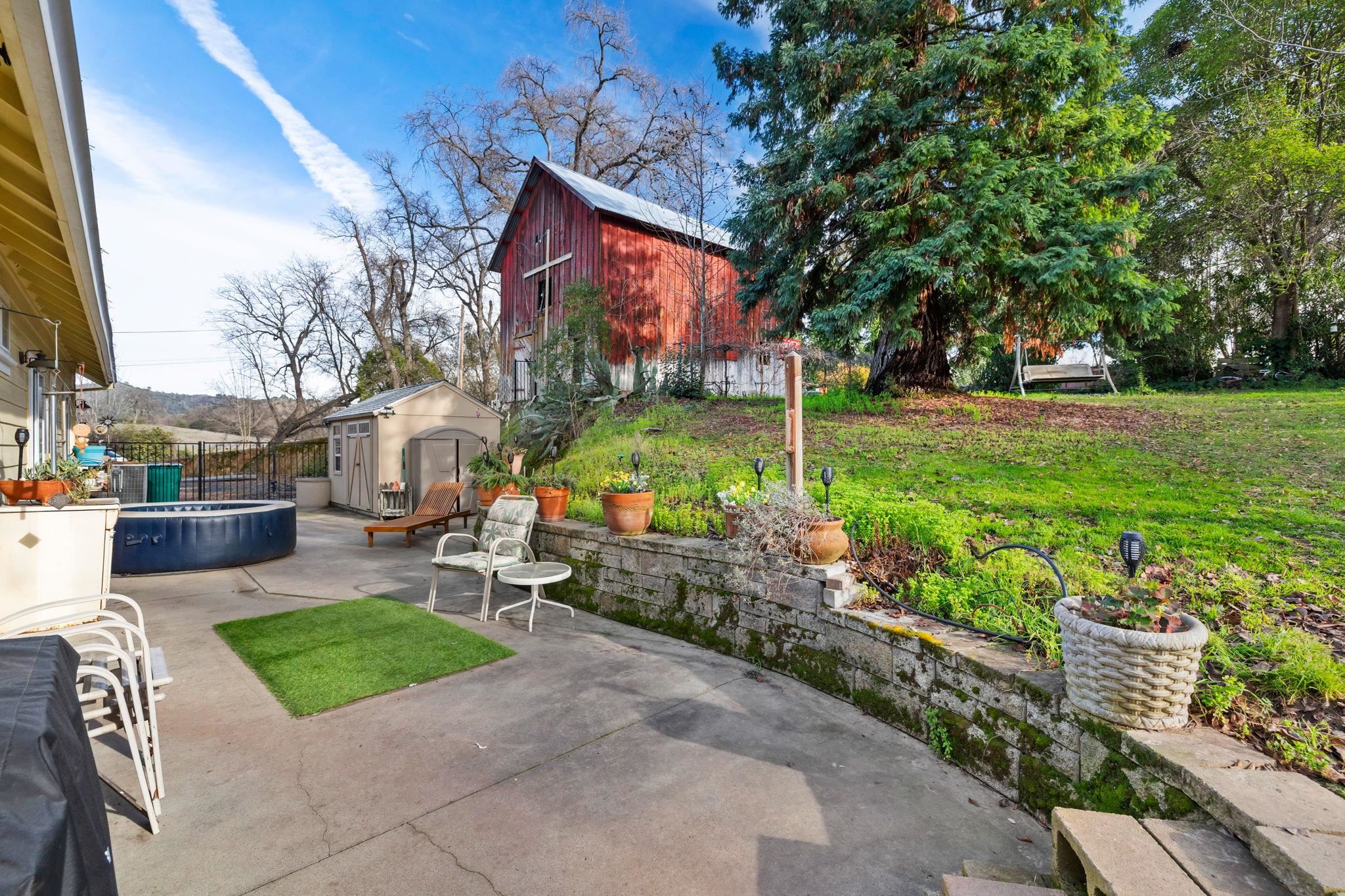 10177 Pulpit Rock Road Jamestown, CA 95327 - Photo 29 of 60 View of patio / terrace with a shed and a hot tub